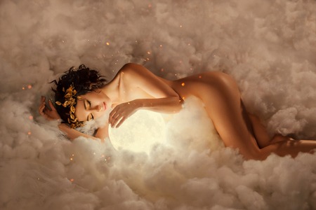 112895190-the-night-and-day-goddess-sleeps-in-the-clouds-as-in-a-thick-white-fog-hugs-the-full-moon-a-naked-nu
